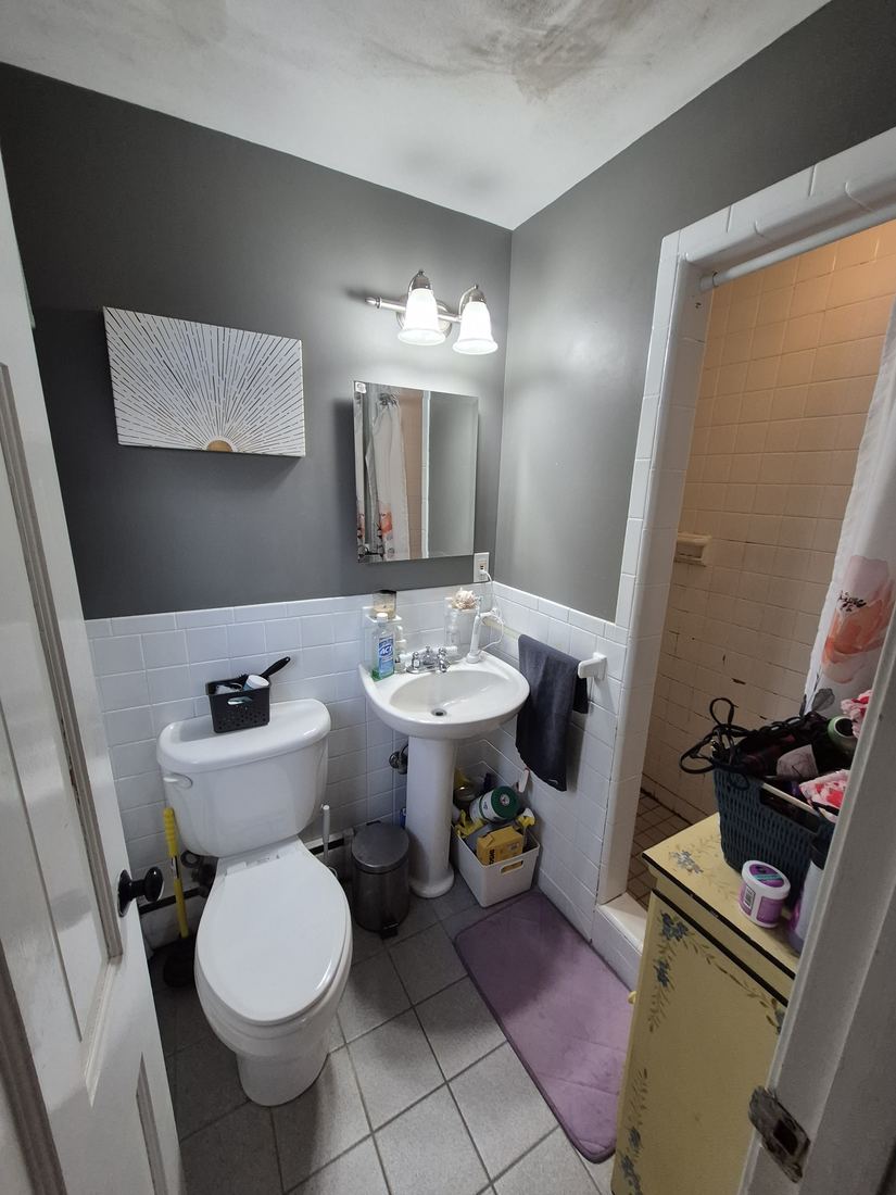 Bathroom in Boxford, MA before shower rebuild with pedestal sink and white wall tile