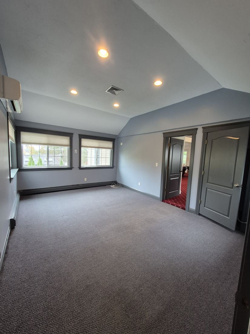 Room in Danvers, MA after painting with gray walls and dark trim
